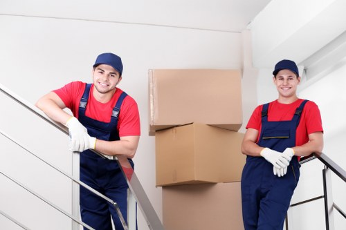 Staff assessing risks before lifting heavy furniture