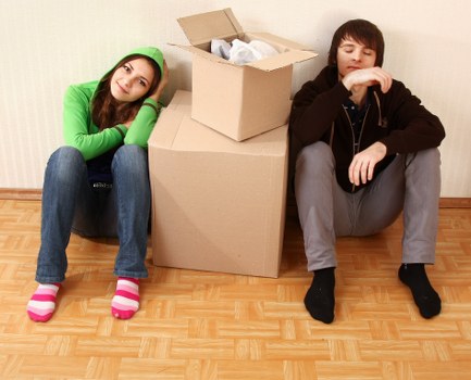 Workers using safe manual handling techniques during a move