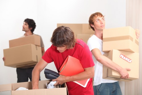 Moving van loading boxes from a Newham flat