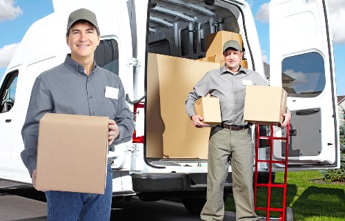 Same day removals van transporting household items across Newham