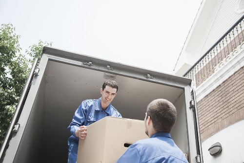 Professional movers carrying boxes during a student relocation