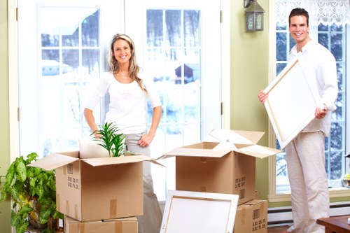 Professional movers handling office equipment in Newham