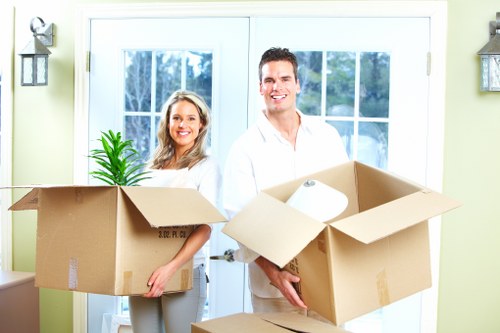 Unpacking boxes and arranging rooms after a move in Newham